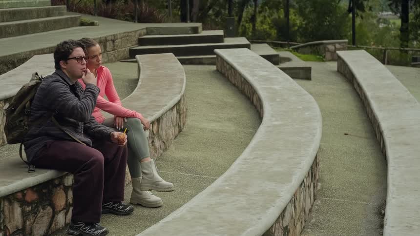 Couple sitting and observing the landscape