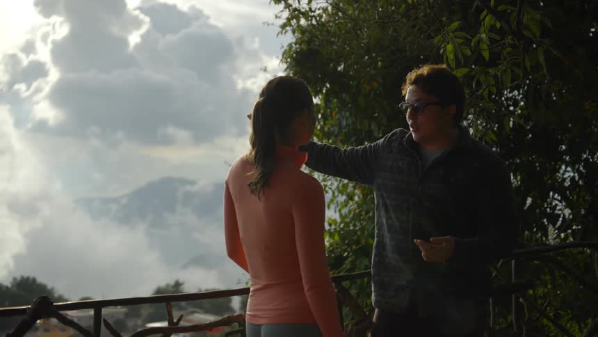 A man and a woman standing outside