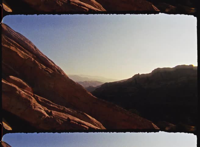 Sunlight shines on mountains across the landscape