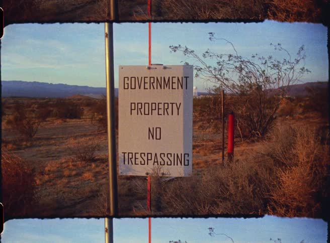 Government property sign prohibiting trespassing in a desert area