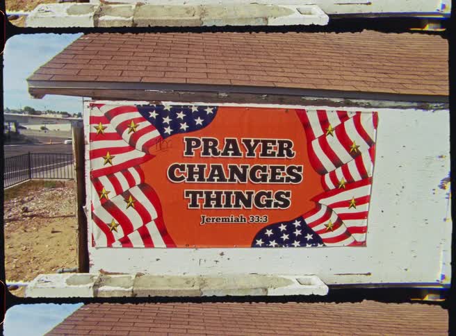 Banner with the united states flag on a white wall in the outdoor area