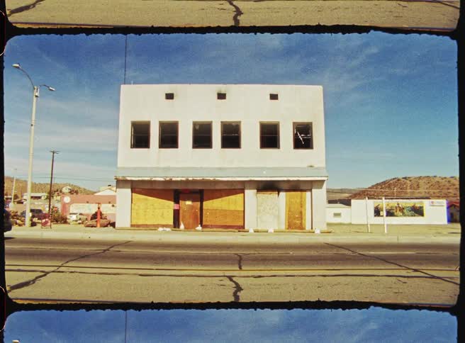 Building under construction with mountains in the background