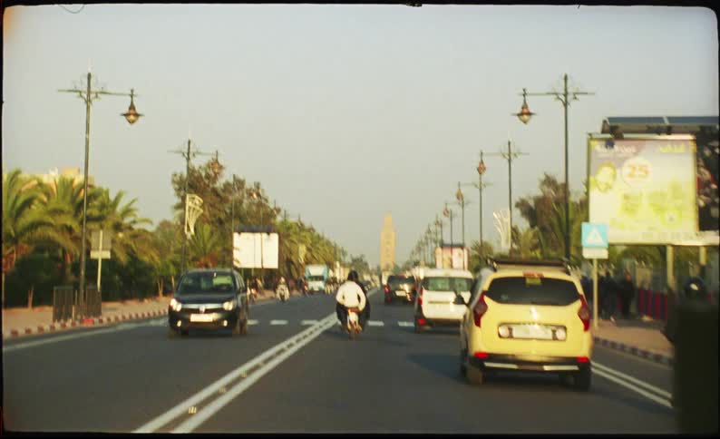 A view of cars driving down a road