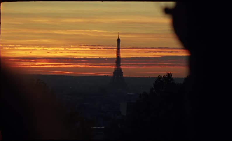 A view of the eiffel tower in france at sunset