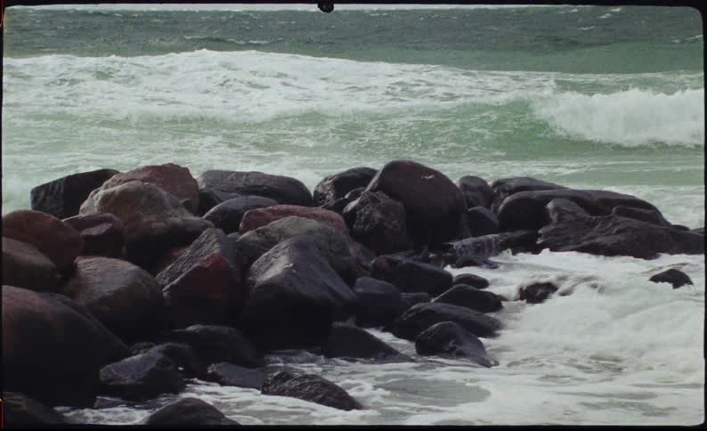 A view of waves crashing onto some rocks