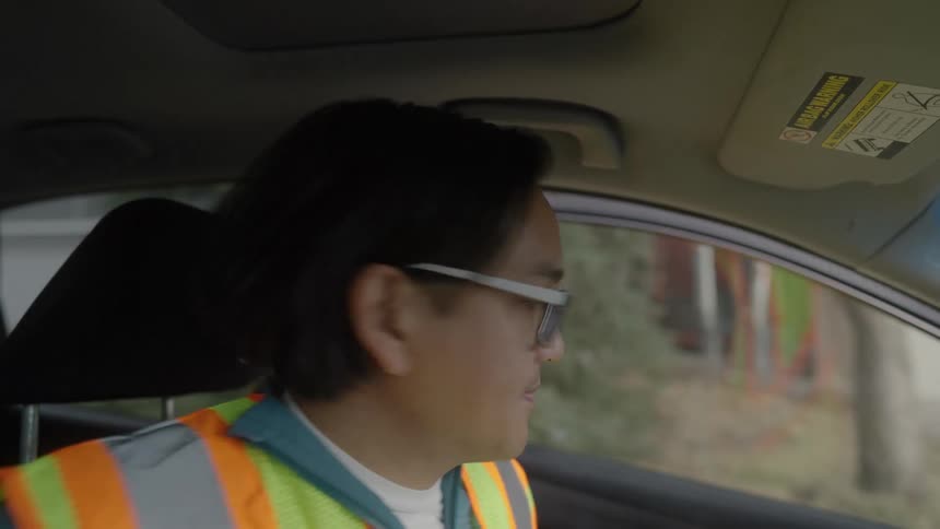 A delivery driver getting out of a car