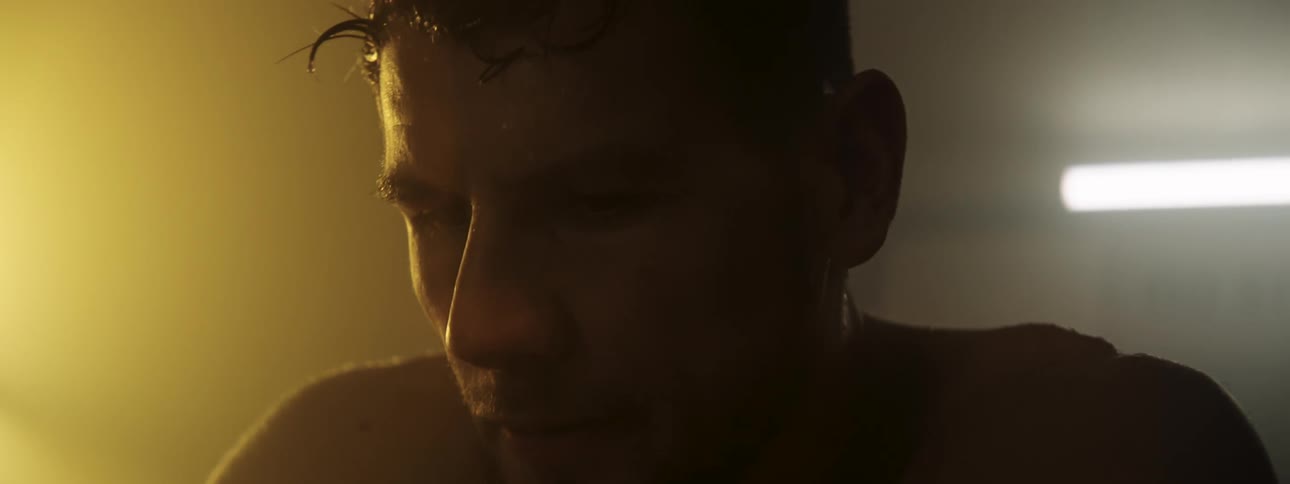 A boxer sitting next to a ring