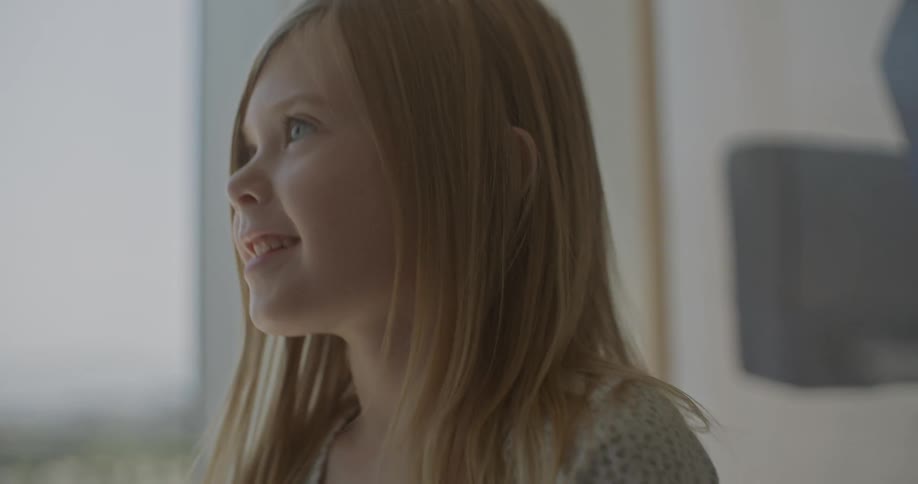 The girl is talking and smiling