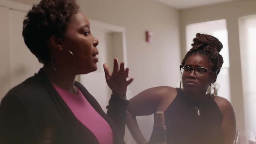 A woman is talking while others listen