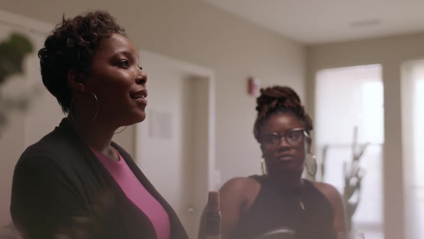 Women talking indoors in the daytime