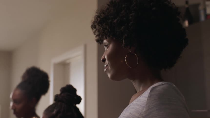 Women talk and laugh with each other in the dining room