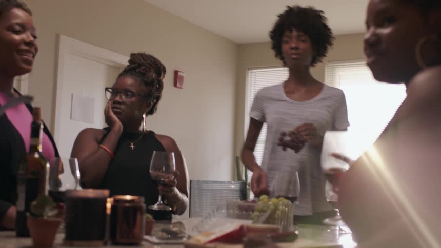 Women eat, drink, and laugh