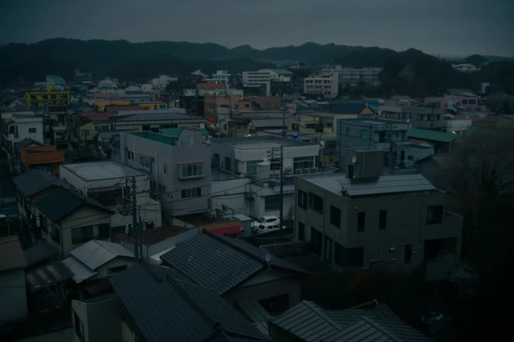 The sun is rising on the small city