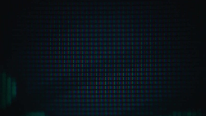 Screen showing a grid of green pixels forming abstract diagonal lines