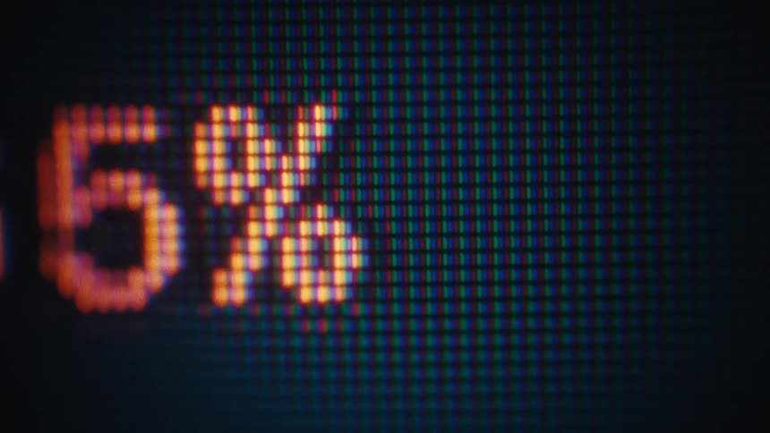 Digitized grids and numbers move across the screen