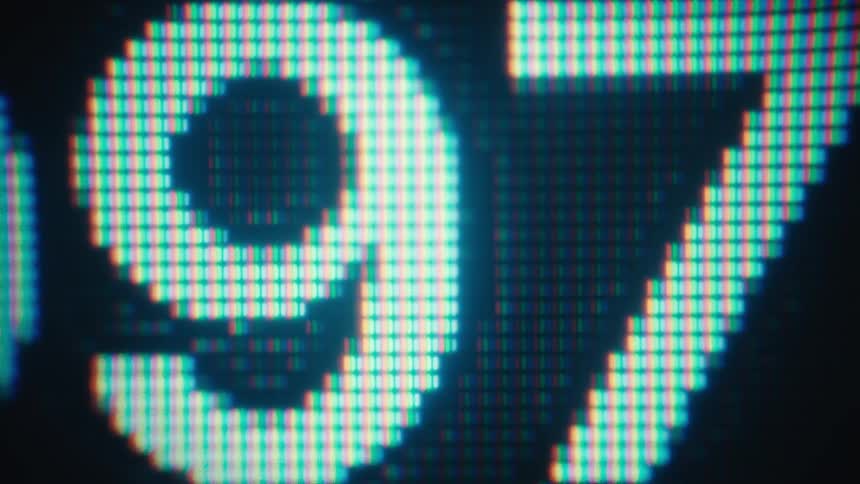 A macro shot captures glowing blue digital numbers rapidly changing on a pixelated screen