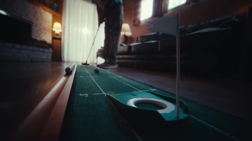A person putting into a cup