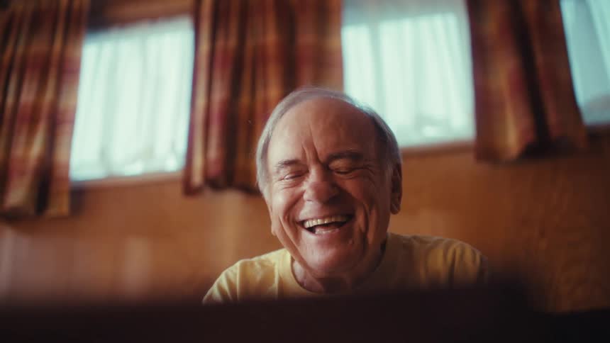 A happy man laughs