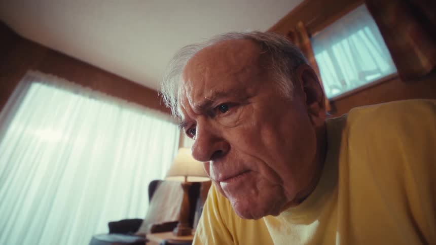 A man using a laptop in a room