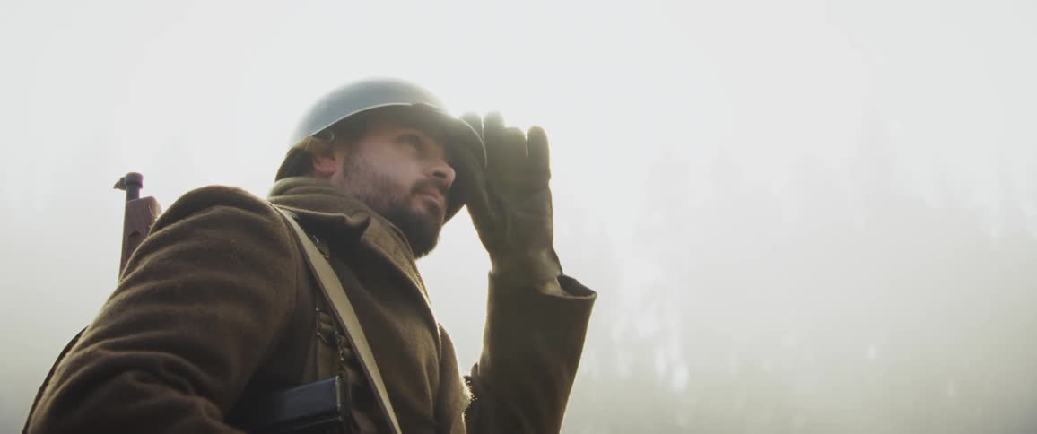 Soldier in a fog in the forest
