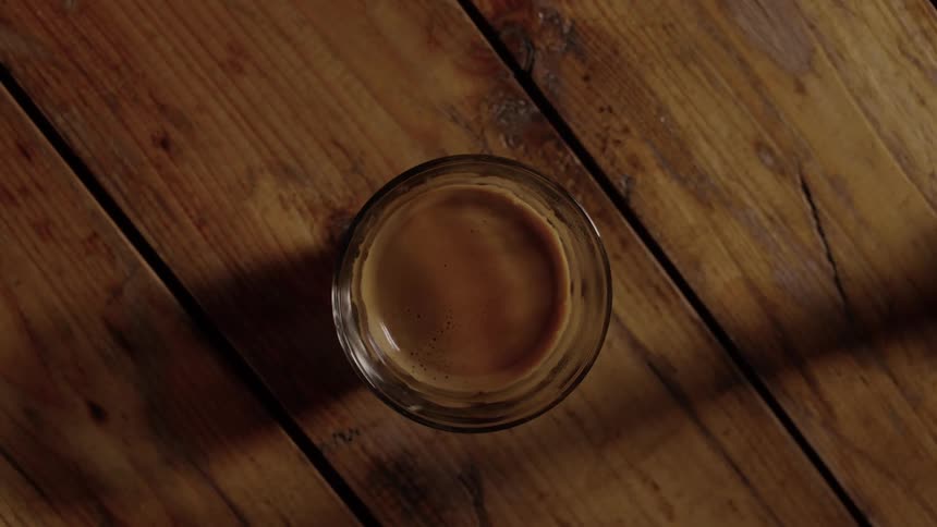 A glass of water is served on the table