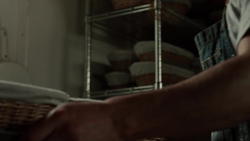 Pair of hands cooking while holding baskets