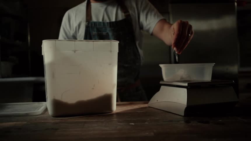 A man weighing out ingredients