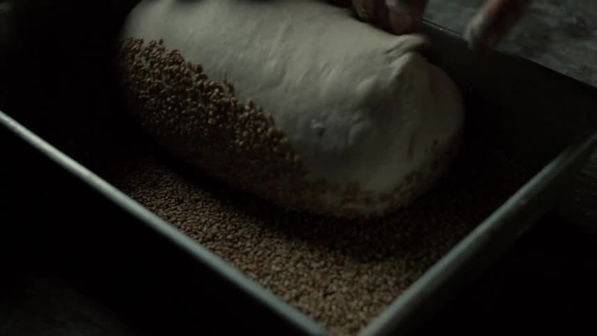 A person making dough