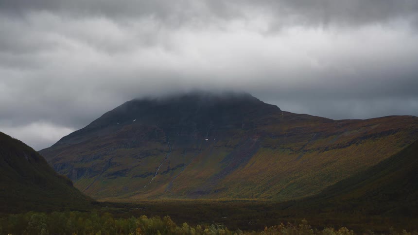 A view of clouds over a mountain