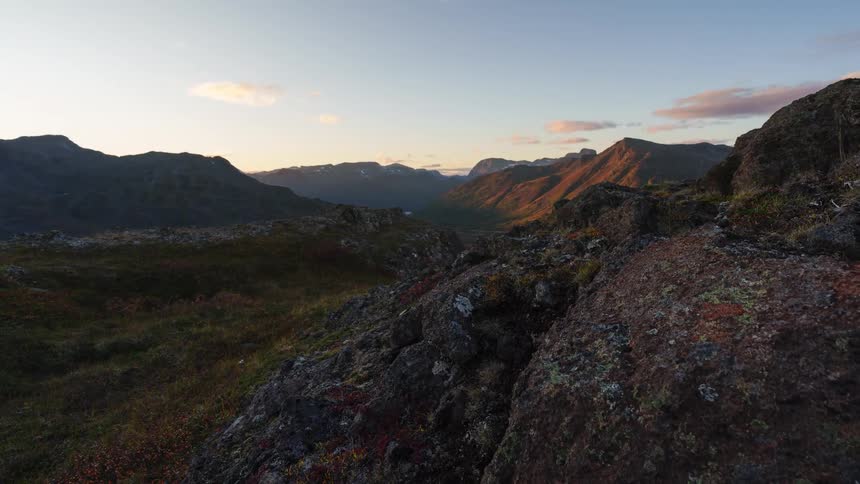 A view of a mountain range with rocks