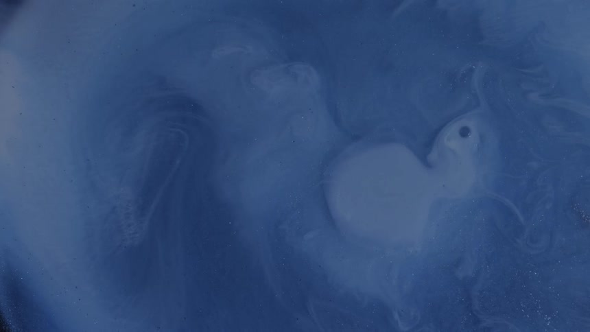 Bubble bursts releasing blue ink