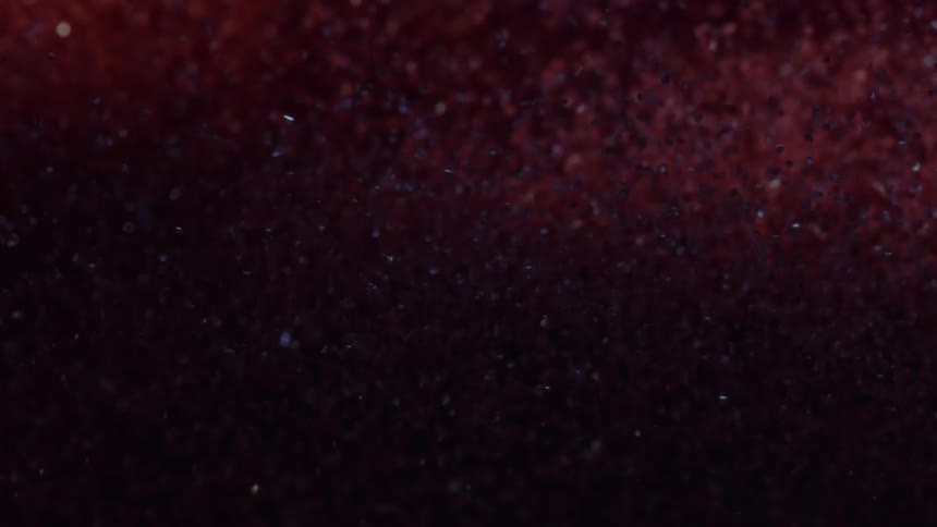 Abstract red pigment in motion