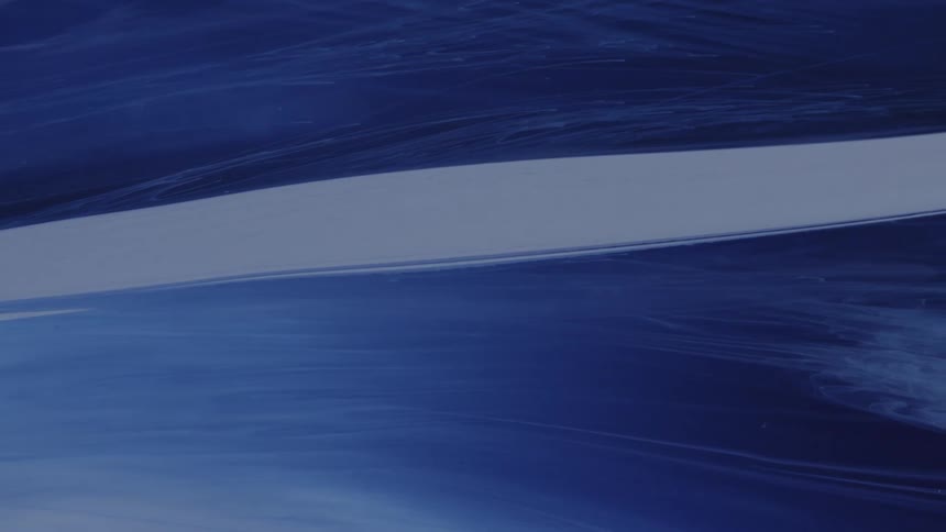 Abstract blue and white fluids swirl and mix together