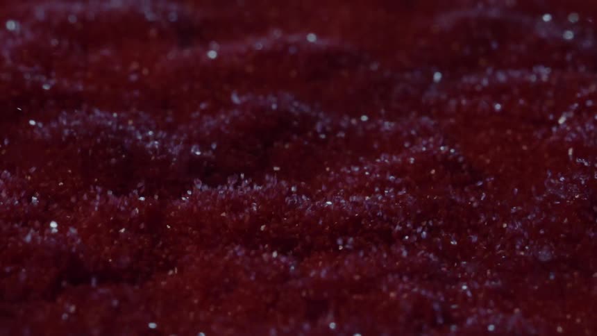 Bright red glitter in abstract motion