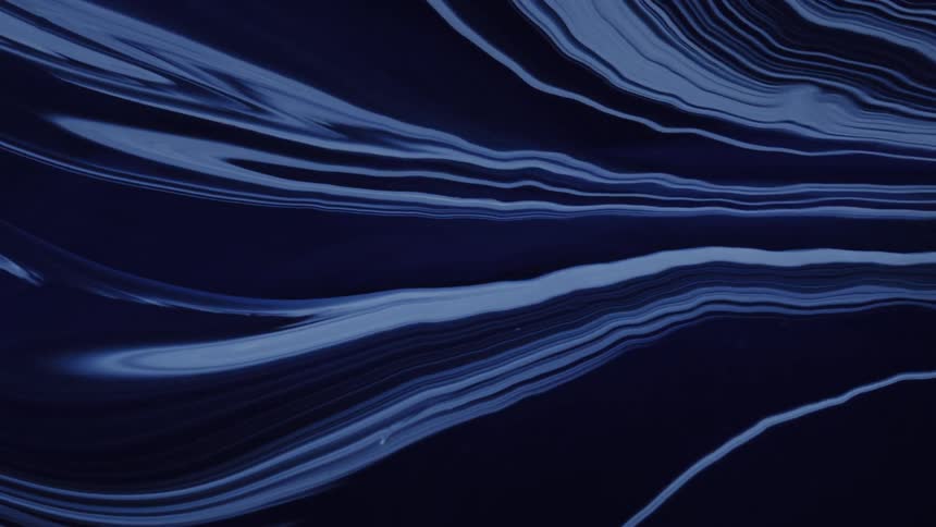 Blue liquid against an abstract background