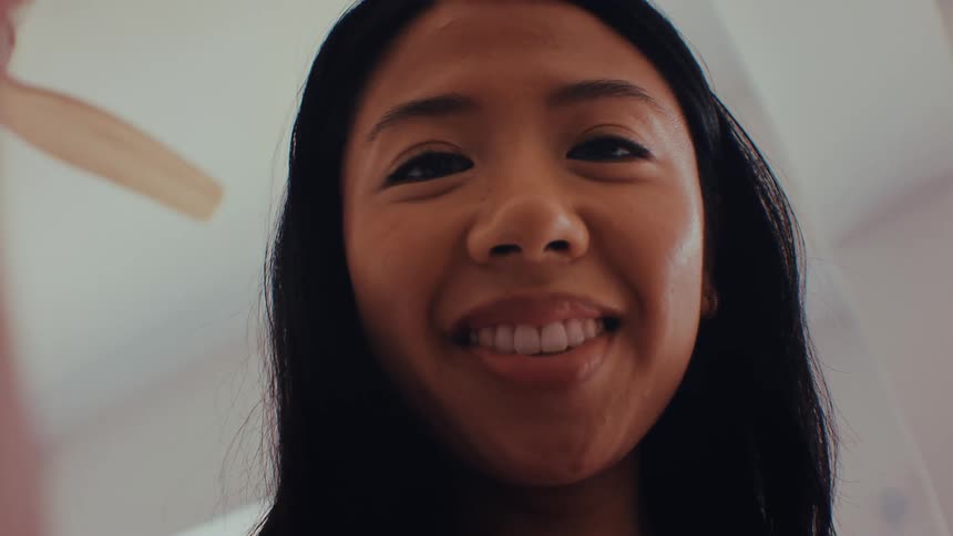 A woman taking a selfie with a camera