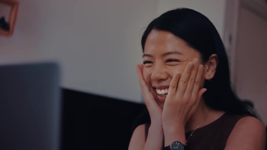 The woman waves and smiles on a video call