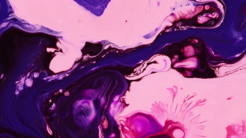 Abstract of vibrant pink and purple liquids swirling in organic patterns