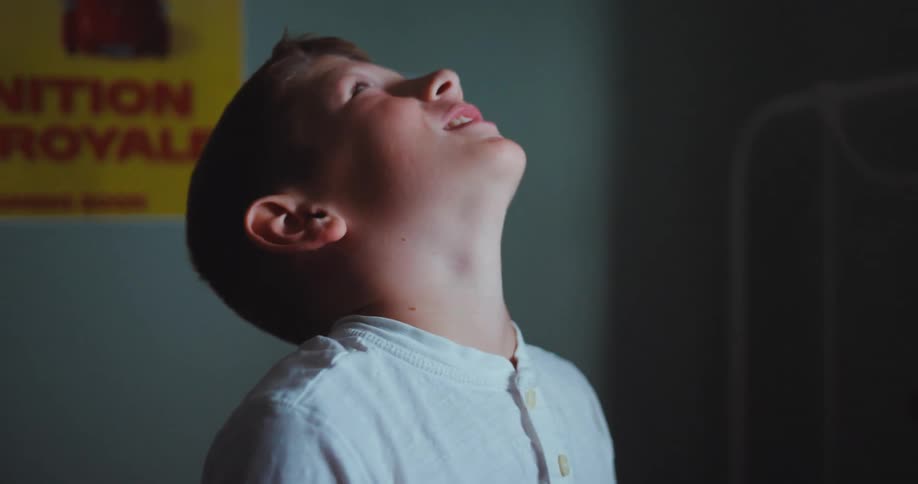A child sitting in a room screaming