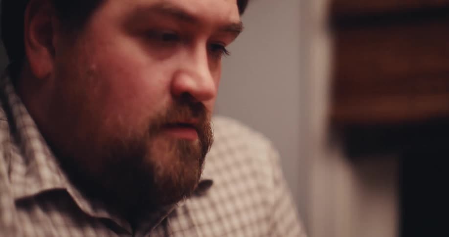 A man sitting at a table eating food