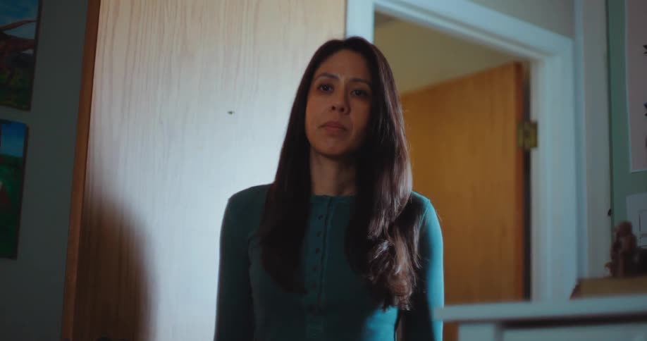 A woman walking into a room
