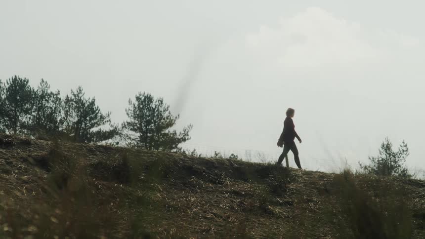 Woman walking on a mountain
