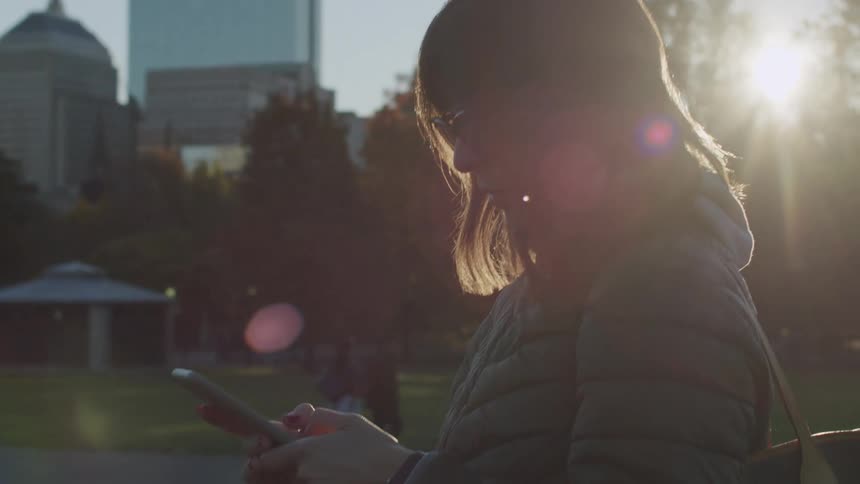 Woman in a square using a smartphone