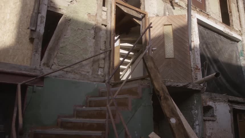 Unfinished house with debris
