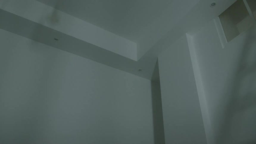 Minimalist corner with recessed lighting and soft shadows in modern interior
