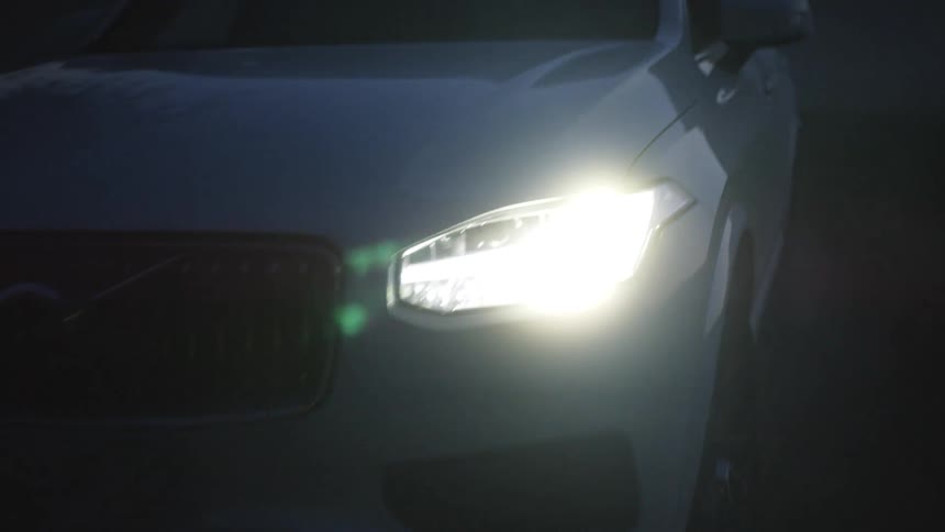 The car backs up in the dark