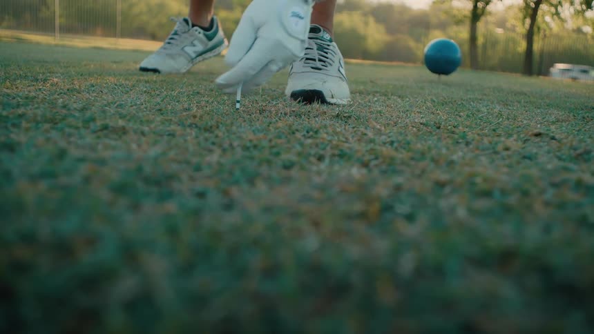 Player positioning golf ball