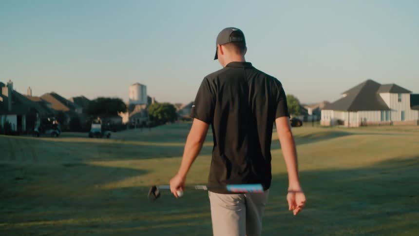 A couple men playing golf