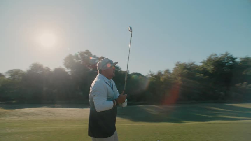 A man getting ready to golf