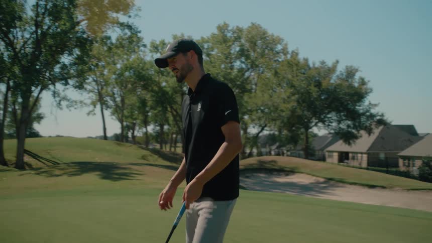 A man putting outdoors